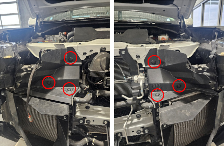 Three wind deflector push pins marked next to each headlight