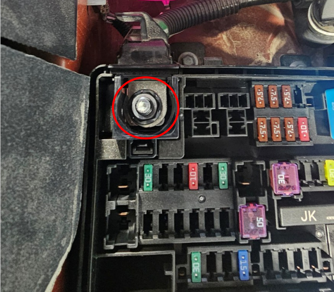 Hybrid inverter power lug marked in the passenger-side fuse box