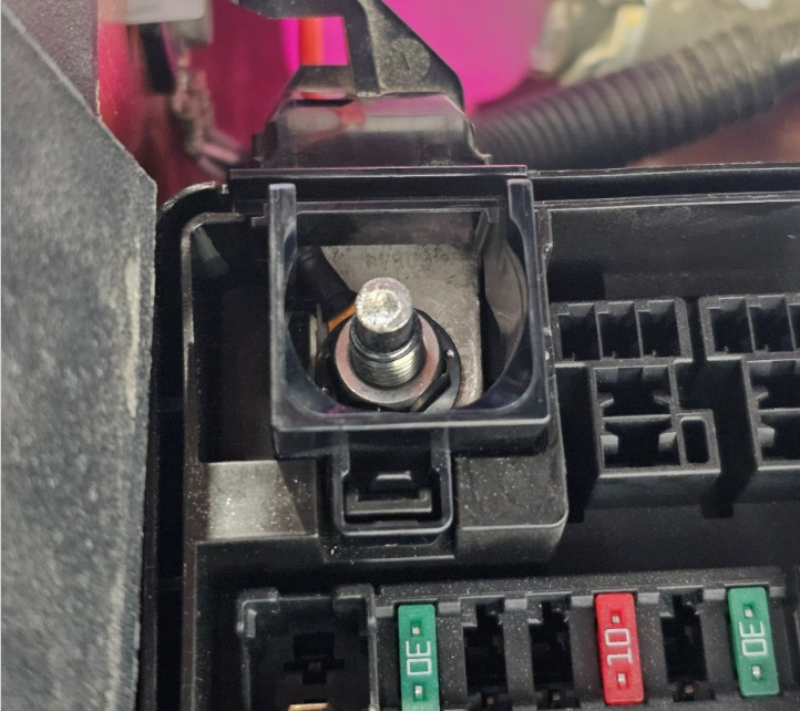 Top protective cover reinstalled over the hybrid power lug